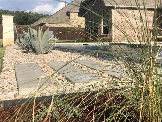 Pavers, gravel, pecan shells & Corten steel