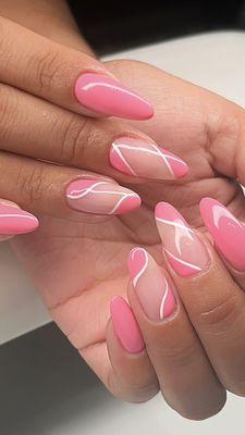 Pink and white free hand design on natural nails.