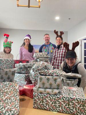 Wrapping presents for our Holiday gift drive.