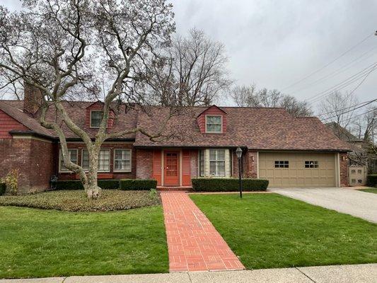 We removed all of the Cedar shake shingles down to the roof board. Installed new plywood over roof boards. Installed CertainTeed shingles