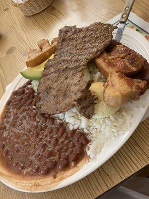 Steak, pork loin, rice and beans, and an egg. So good