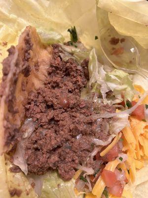 This "beef" taco had mostly beans mashed into the taco meat. It tasted bland and nasty.