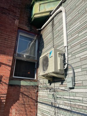 Outdoor Condenser installed about 6' up the wall.