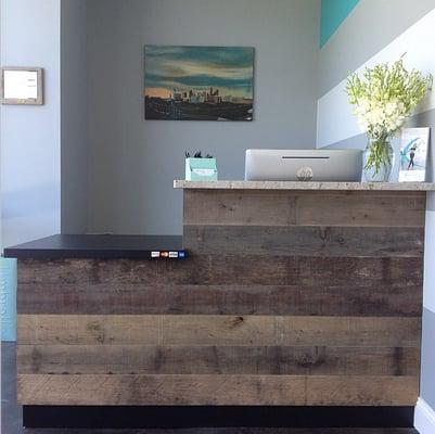 Our lobby desk showcasing reclaimed Hickory!