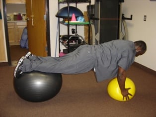 Advanced planking exercises with two ball to increase difficulty and challenge the core.