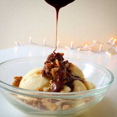 Double Chocolate Granola on vanilla ice cream topped with chocolate sauce.