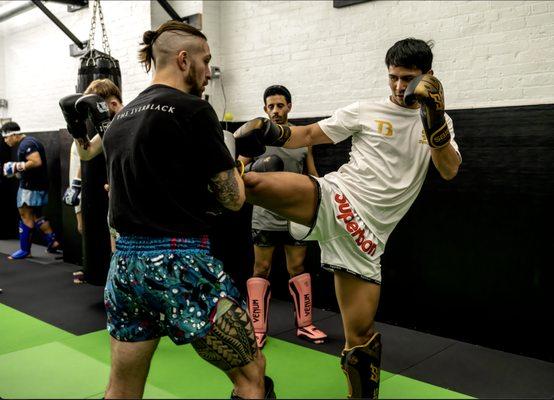 Head instructor John Piña drills with Superbon