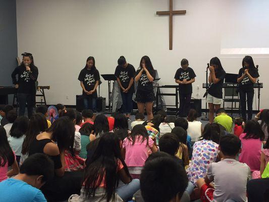 Our Youth Team is teaching the kids new worship songs. They did a great job!