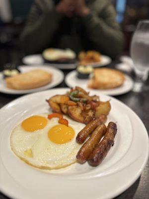 Breakfast your way - Eggs, potatoes and sausage with coffee