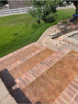 Stamped concrete and brick stairway.