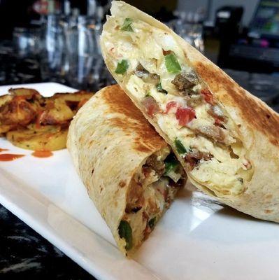 Little Piggy Breakfast Wrap - scrambled eggs, bacon, sausage, ham, onion, bell pepper, tomato, American cheese.