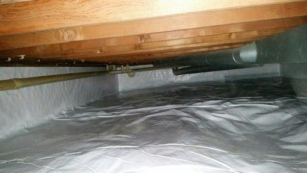 The MidAmerica team encapsulated this Crawl Space with CleanSpace liner and installed a SmartDrain to keep water from pooling in the space.