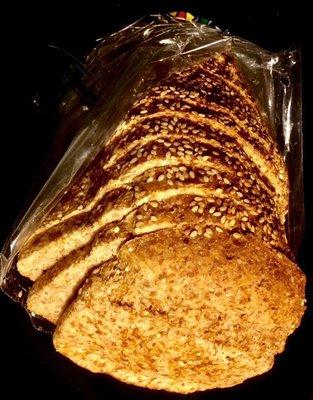 A loaf of "Ezekiel 4:9" Sesame. Flourless bread with wholesome whole-grain texture.