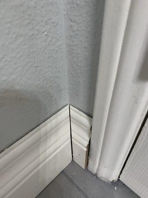 No caulking and uneven cutting of baseboards