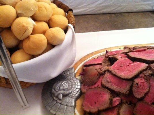 Grilled Beef Tenderloin Rubbed with Cracked Pepper and Herbs and Served with Fresh Rolls