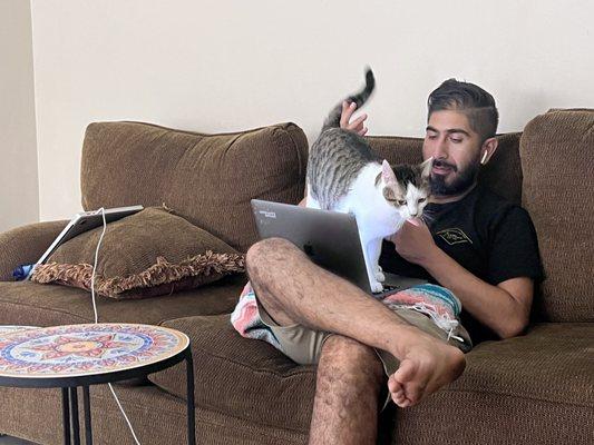 Antonio letting our little guy help with his computer work.