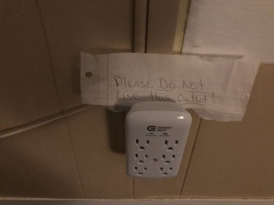 Note says - "Please do  not use this outlet."  It was handwritten on a torn piece of paper.