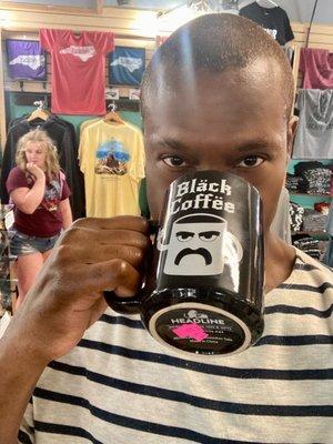 Black man. Black coffee mug.