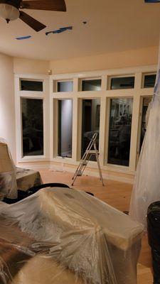 Refinish and paint bay windows from oak to white no grain show.