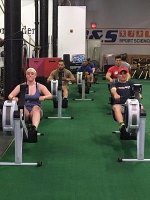 Dave and Jess rowing hard.