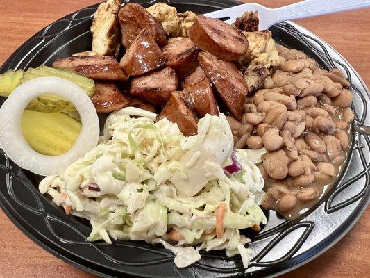 Two meat plate with Georgia Juice Chicken and Smoked Sausage, Coleslaw, and BBQ Beans.