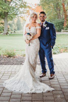 Bride and groom in blue at A Gold course shot by photographer Julie Johnson from Ja design and photo, llc