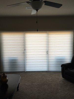 Dual Shades with Power Wand Motorizations 3 shades over Sliding door.