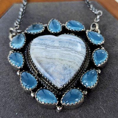 Blue agate heart necklace set in sterling silver.