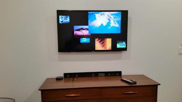 42" TV wall mounted with wires concealed in the wall.