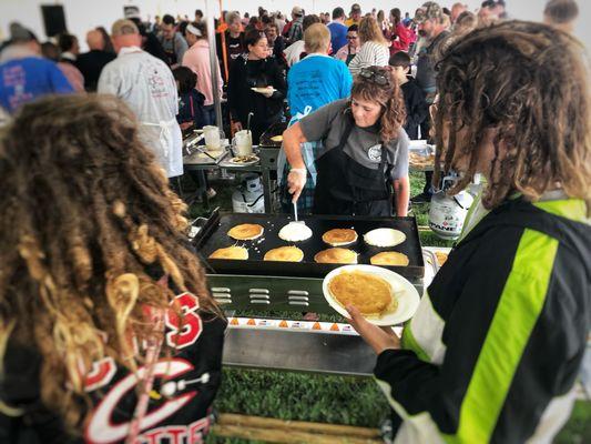 Local nonprofits, businesses, and churches all volunteer to serve pancakes during Pancake Day.