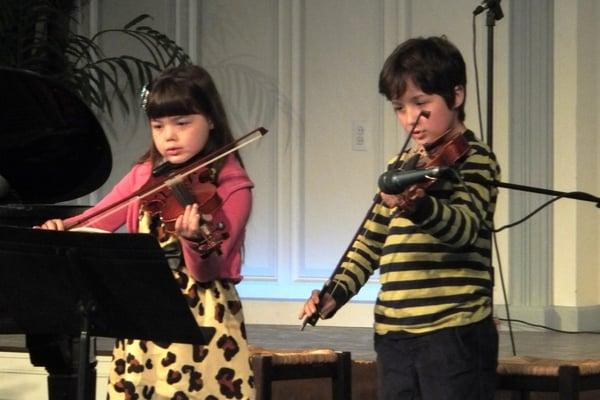 Violin students performing at our semi-annual recital.