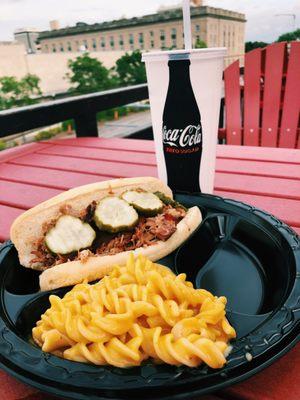 Our mac n cheese and pulled chicken sandwich is the perfect meal to have on the rooftop!