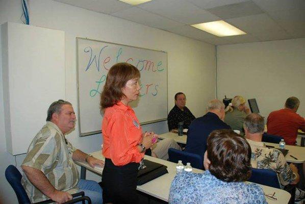 Founder Penny Byram talking at a caregiving luncheon for Orange County