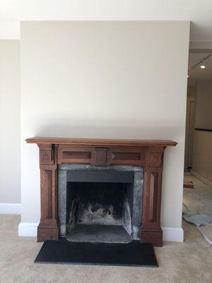 Repainted walls makes the fireplace pop