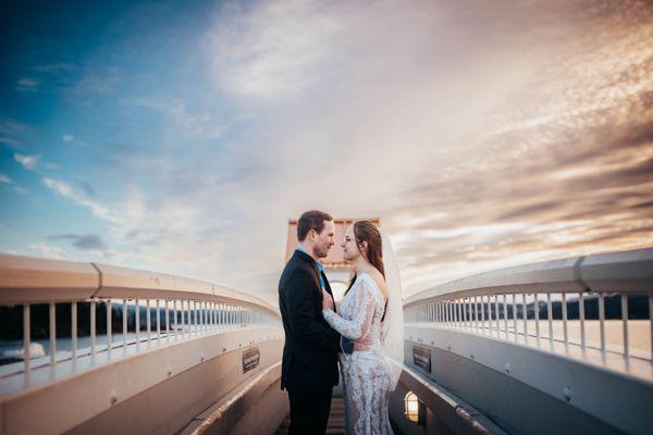 Wedded Couple on Lake Coeur d'Alene boardwalk in ID - Photos by Kendra with Earthbound Photography