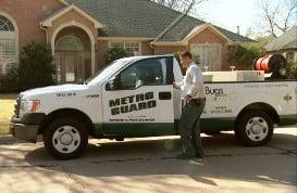 Uniformed pest and termite technicians driving professional vehicles.