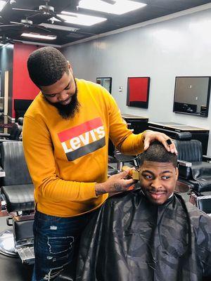 Provide another Hair cut and smile by owner and operator Xavier Young.