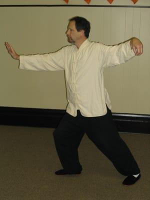 Master Rothrock demonstrates the Tai Chi move "Single Whip", which stretches out the back and develops the muscles and tendon...