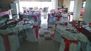 White Folding Chair Covers and Red Sashes