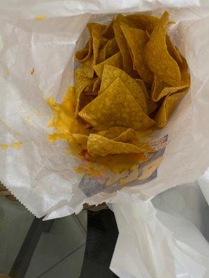 I order chips and queso and this is what the bag was like when I opened it. Lid wasn't even all the way on and cheese everywhere