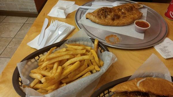 Regular fries that came with sub. Big portion, also decent. Calzone in back which was good.