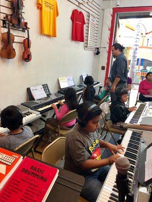 Mister Sarmiento in piano class with our intermediate students.