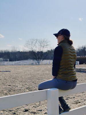 Trainer, Anna, teaching a private lesson in our 100x200 outdoor arena with brand new footing!