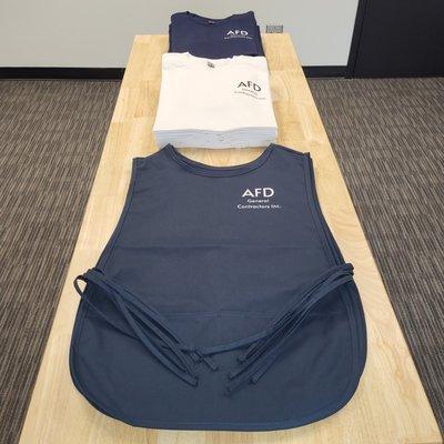 Staff shirts and aprons for cleaning company