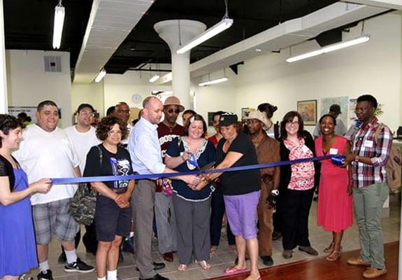 Members of the clubhouse celebrate its new location with a ribbon-cutting ceremony in Long Island City in April 2013.