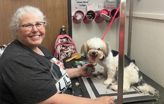 Experience expert care in our grooming services at Lily's Play-N-Stay, showcased in this engaging photo of our head groomer d...