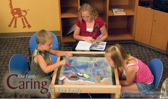 children playing with sensory toys in the family medical specialties' clinic lobby