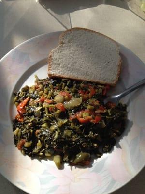 Callaloo with some hard dough bread.