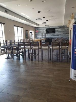 Breakfast area. High tables and chairs.