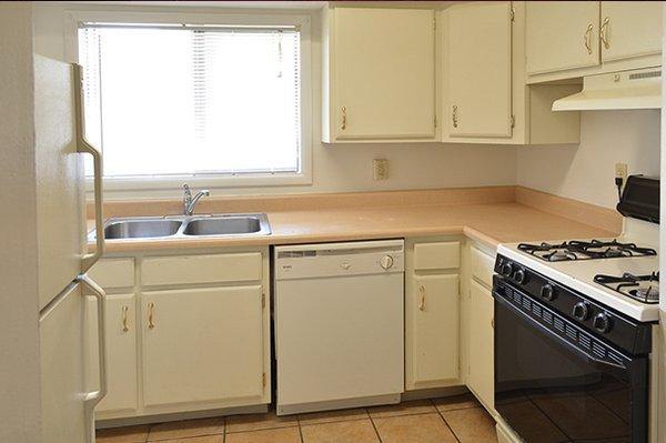 Our kitchens offer great cabinet storage with a double sink.